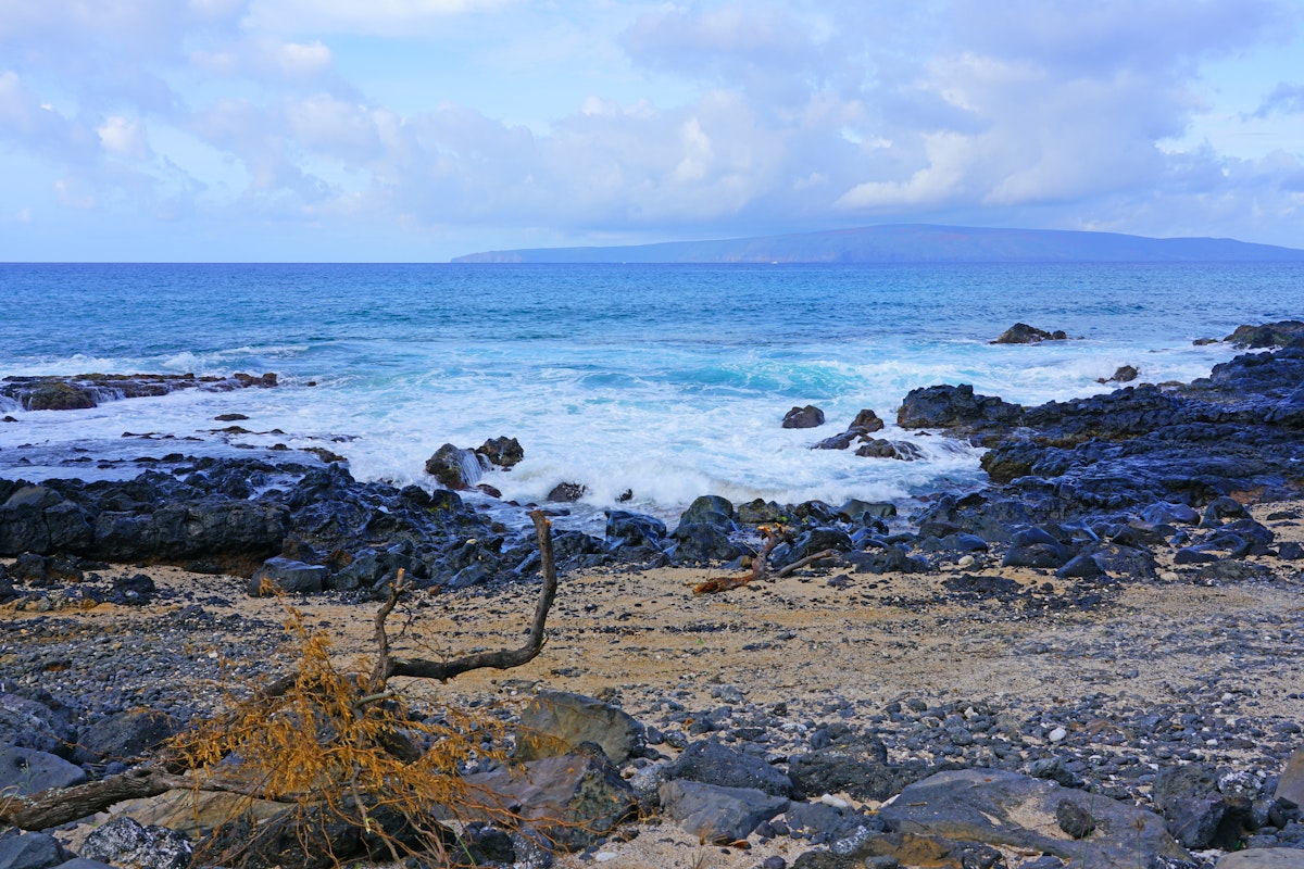 View of black lava rock and ocean at the Ahihi-Kinau Natural Area Reserve, on the West shore of Maui south of Wailea and Makena, Hawaii.