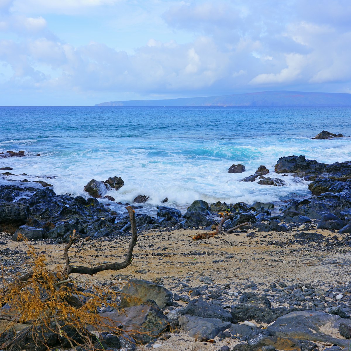 View of black lava rock and ocean at the Ahihi-Kinau Natural Area Reserve, on the West shore of Maui south of Wailea and Makena, Hawaii.