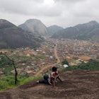 Tourist sitting on a mountain top in idanre town, Ondo state, Nigeria; Shutterstock ID 1270238518; your: Claire Naylor; gl: 65050; netsuite: Online ed; full: Nigeria best places
1270238518