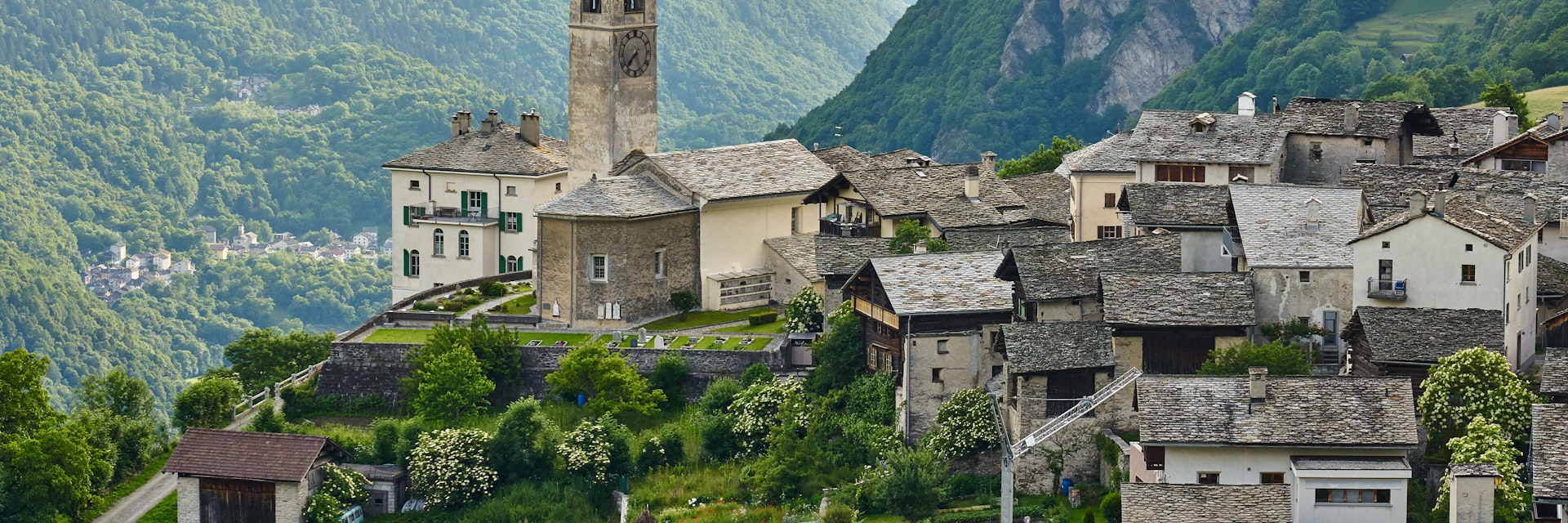 Church and old houses of mountain village Soglio, Switzerland.