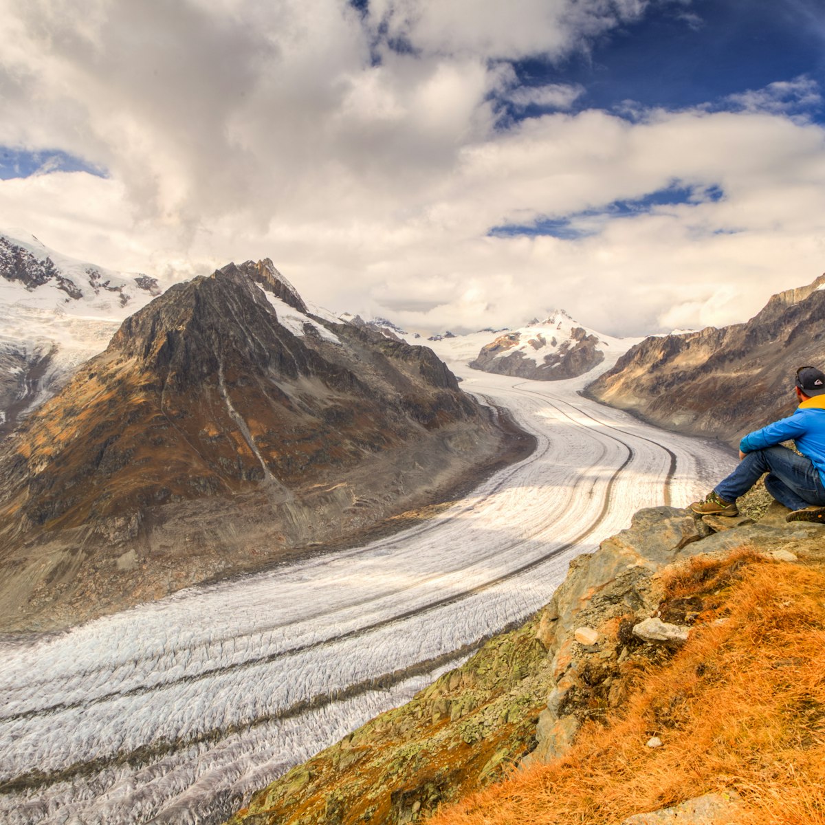 A hiker explores the Aletsch glacier.
