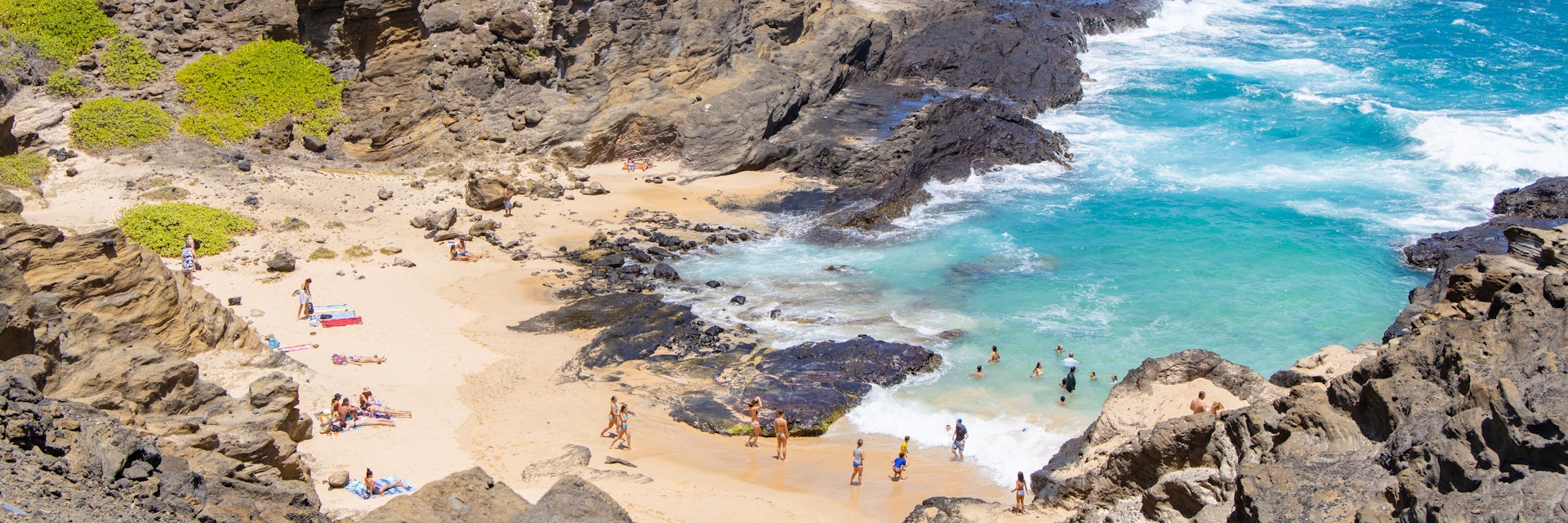 Halona Beach Cove, a small sandy beach surrounded by rocky cove at Oahu southeast.