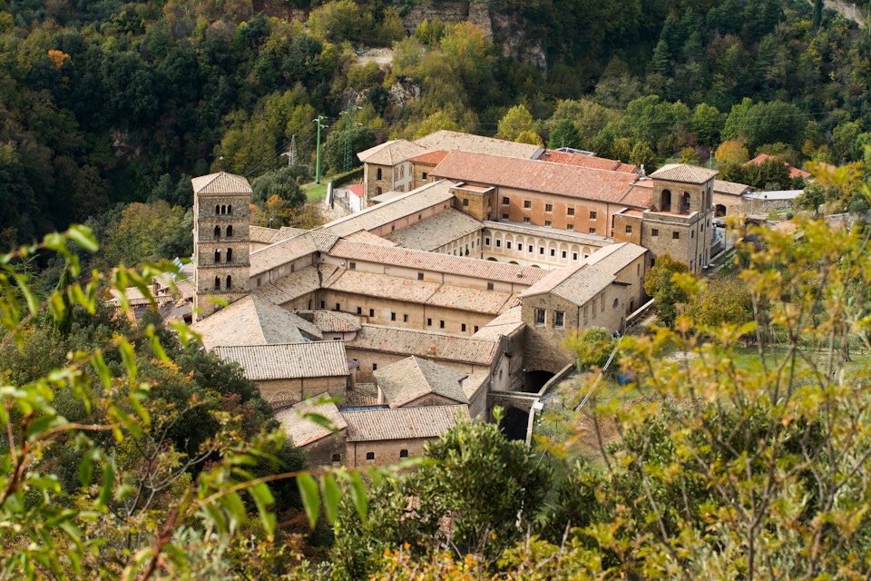 Saint Scholastica medieval monastery surrounded by trees in Subiaco. 