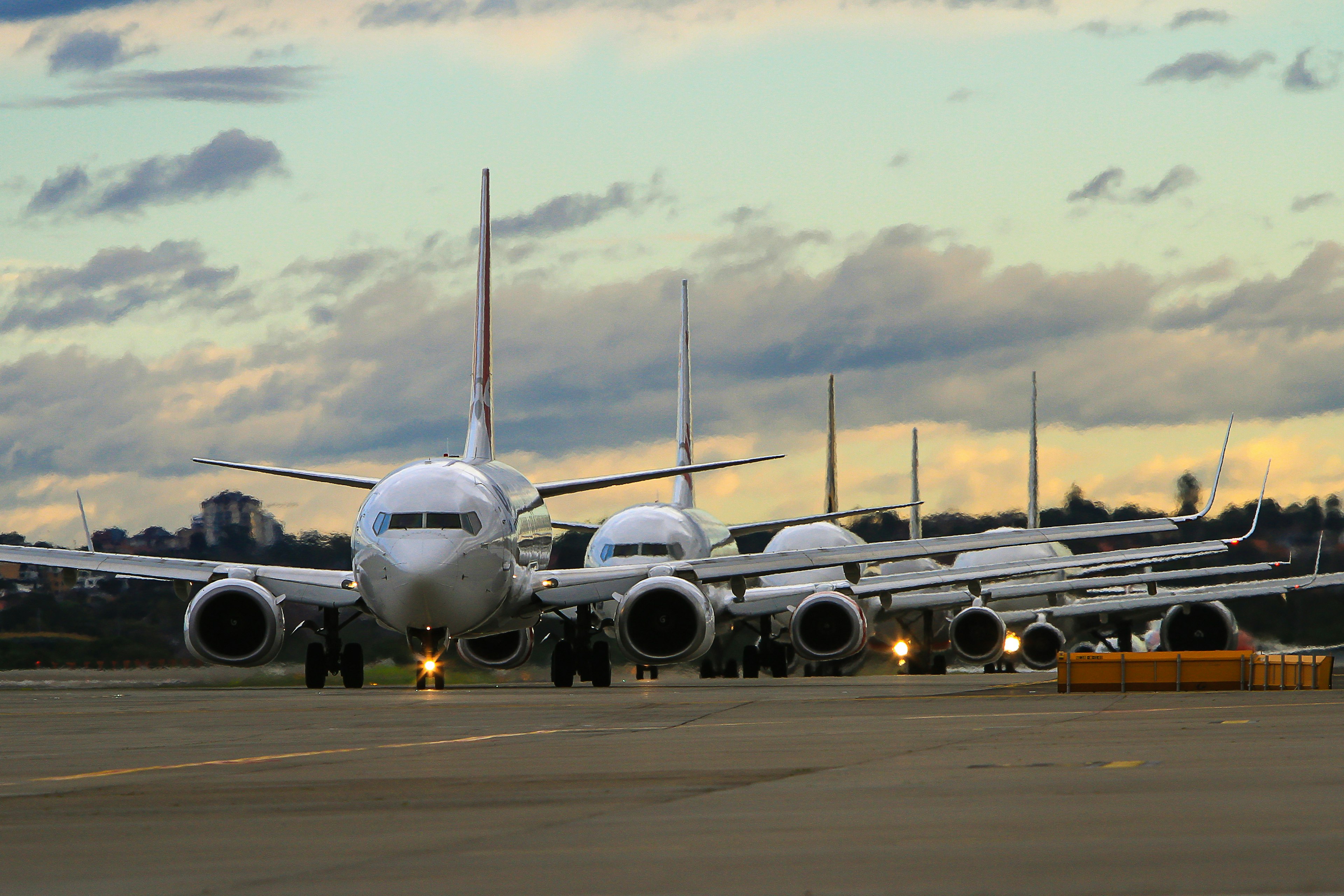 A queue of planes on a runway awaiting permission to proceed