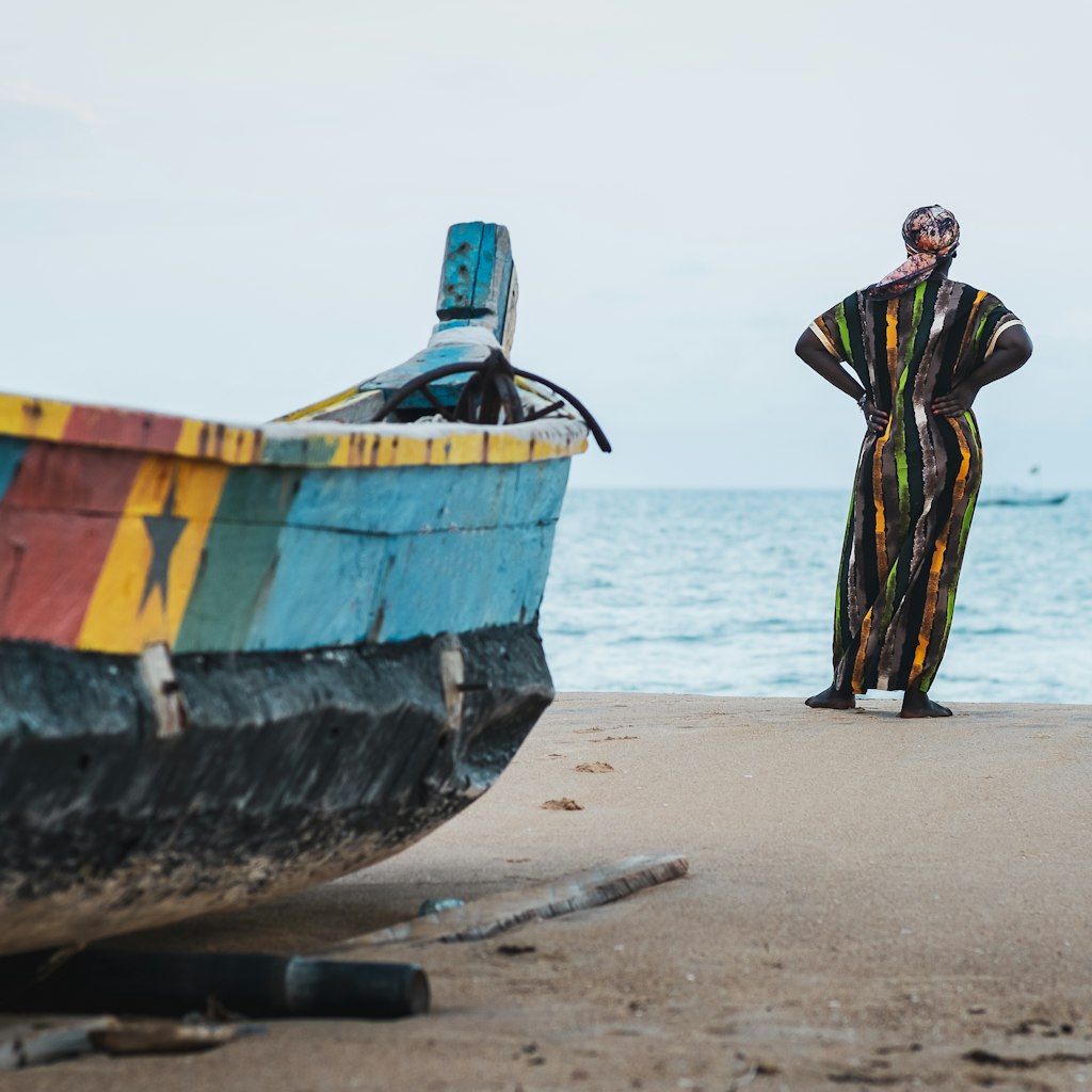 African woman in long suit standing by the shore and looking out over the sea in Keta Ghana West Africa; Shutterstock ID 2074877581; your: Claire Naylor; gl: 65050; netsuite: Online editorial; full: Ghana visas
2074877581