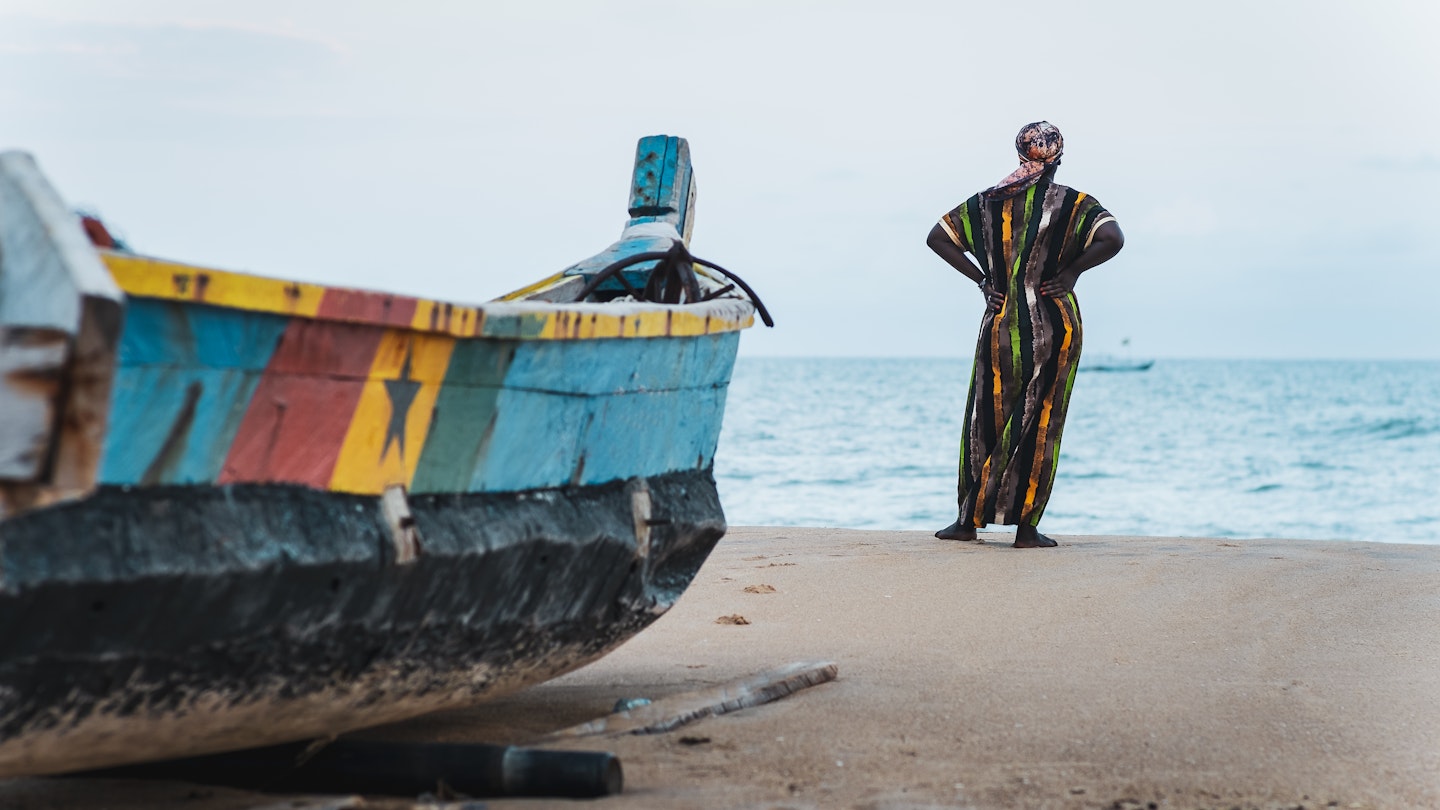 African woman in long suit standing by the shore and looking out over the sea in Keta Ghana West Africa; Shutterstock ID 2074877581; your: Claire Naylor; gl: 65050; netsuite: Online editorial; full: Ghana visas
2074877581