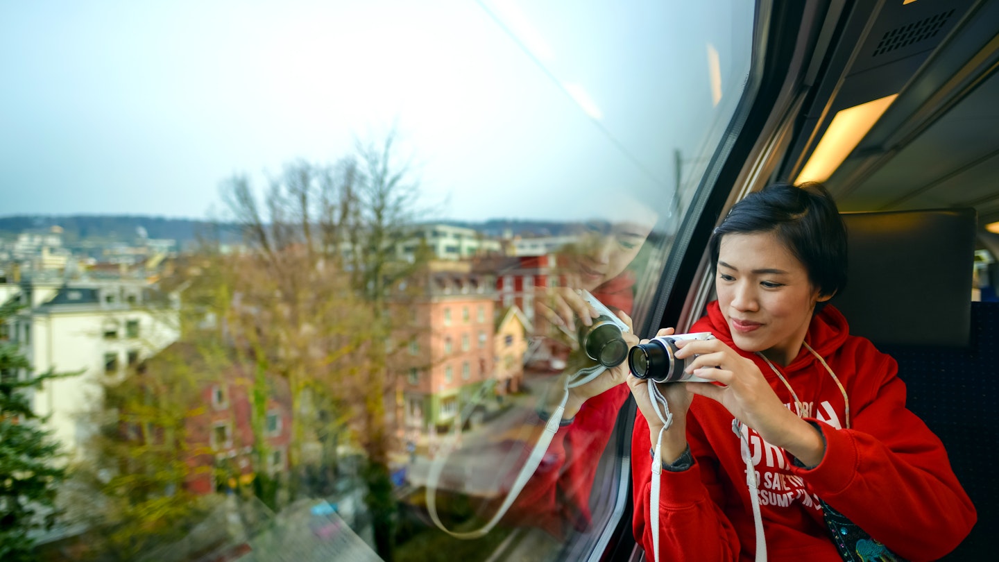 One Asian adult female visitor holding camera and looking at view through SBB train window in Zurich, Switzerland; Shutterstock ID 642224845; your: Tasmin Waby; gl: 65050; netsuite: Online Editorial; full: Demand project/ Zurich TTK
642224845