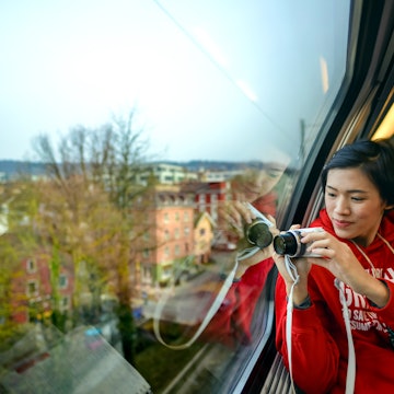 One Asian adult female visitor holding camera and looking at view through SBB train window in Zurich, Switzerland; Shutterstock ID 642224845; your: Tasmin Waby; gl: 65050; netsuite: Online Editorial; full: Demand project/ Zurich TTK
642224845