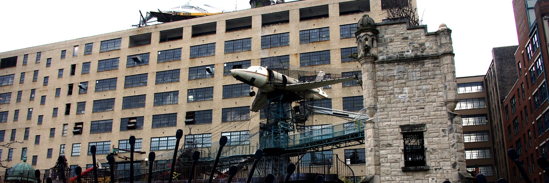The playground at the City Museum with airplane tower and hanging school bus in St. Louis.