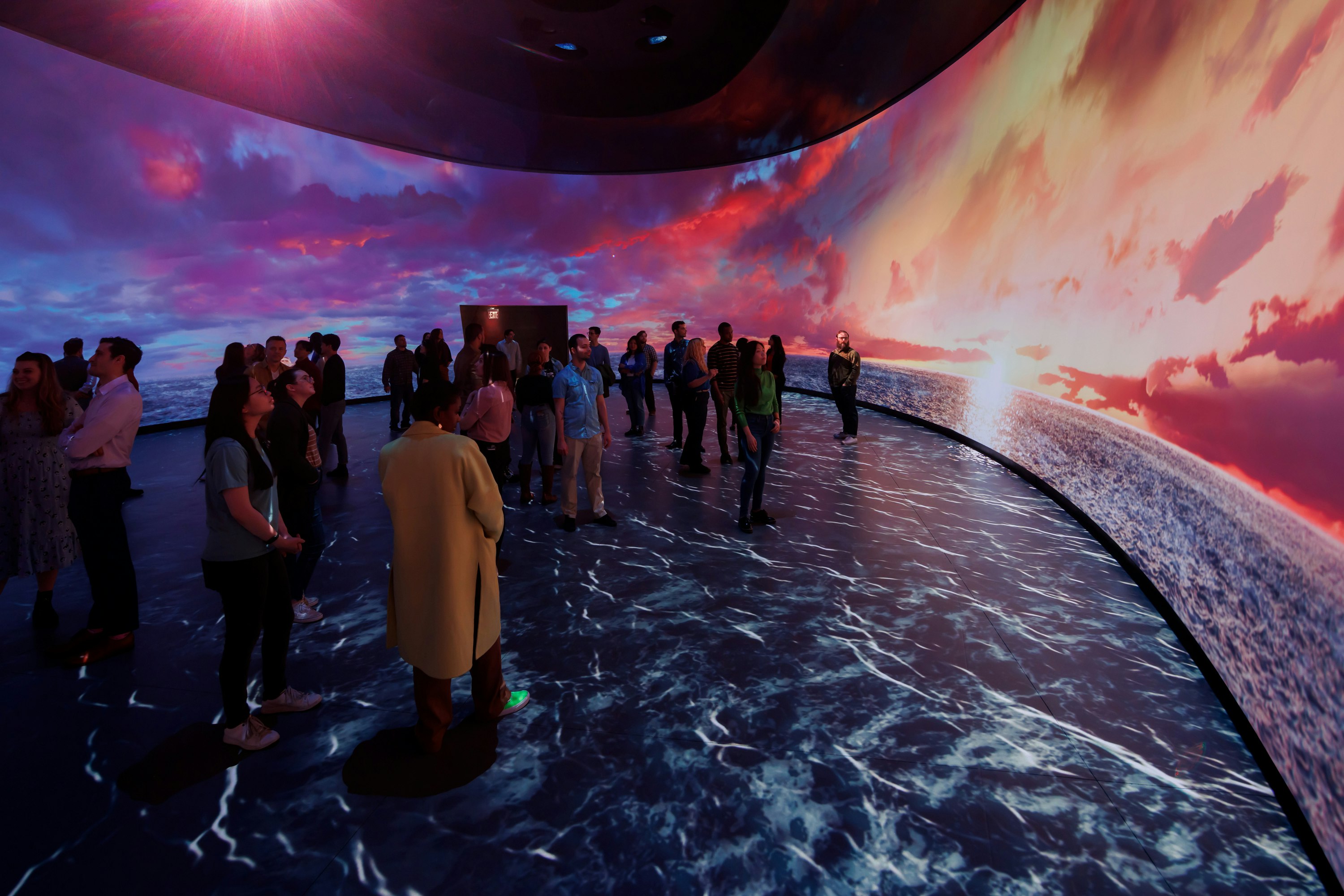 People in the interactive exhibit “Invisible Worlds” at the American Museum of Natural History’s Gilder Center, New York, New York, USA