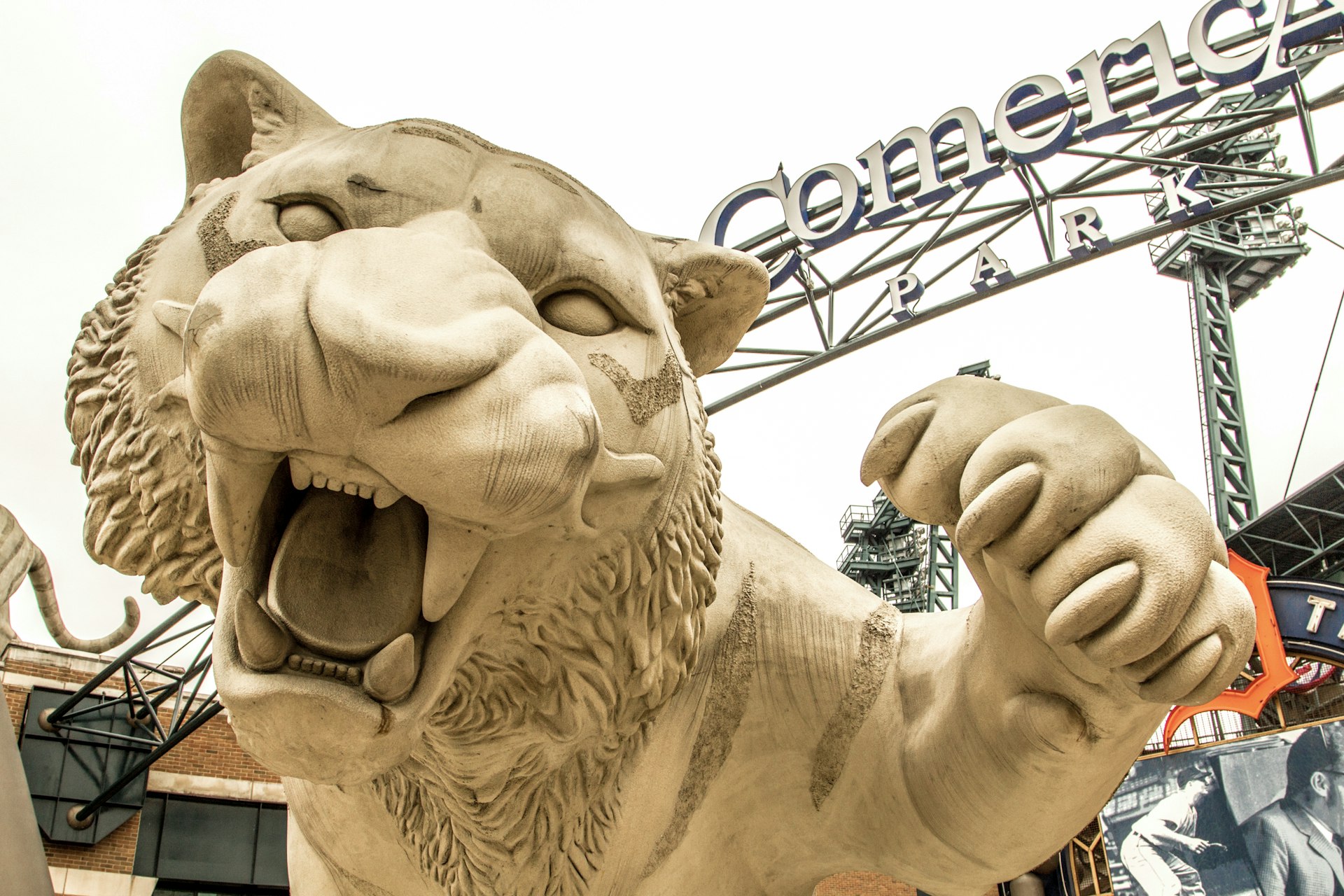 A low-angle view of the white tiger sculpture outside of Comerica Park in Detroit