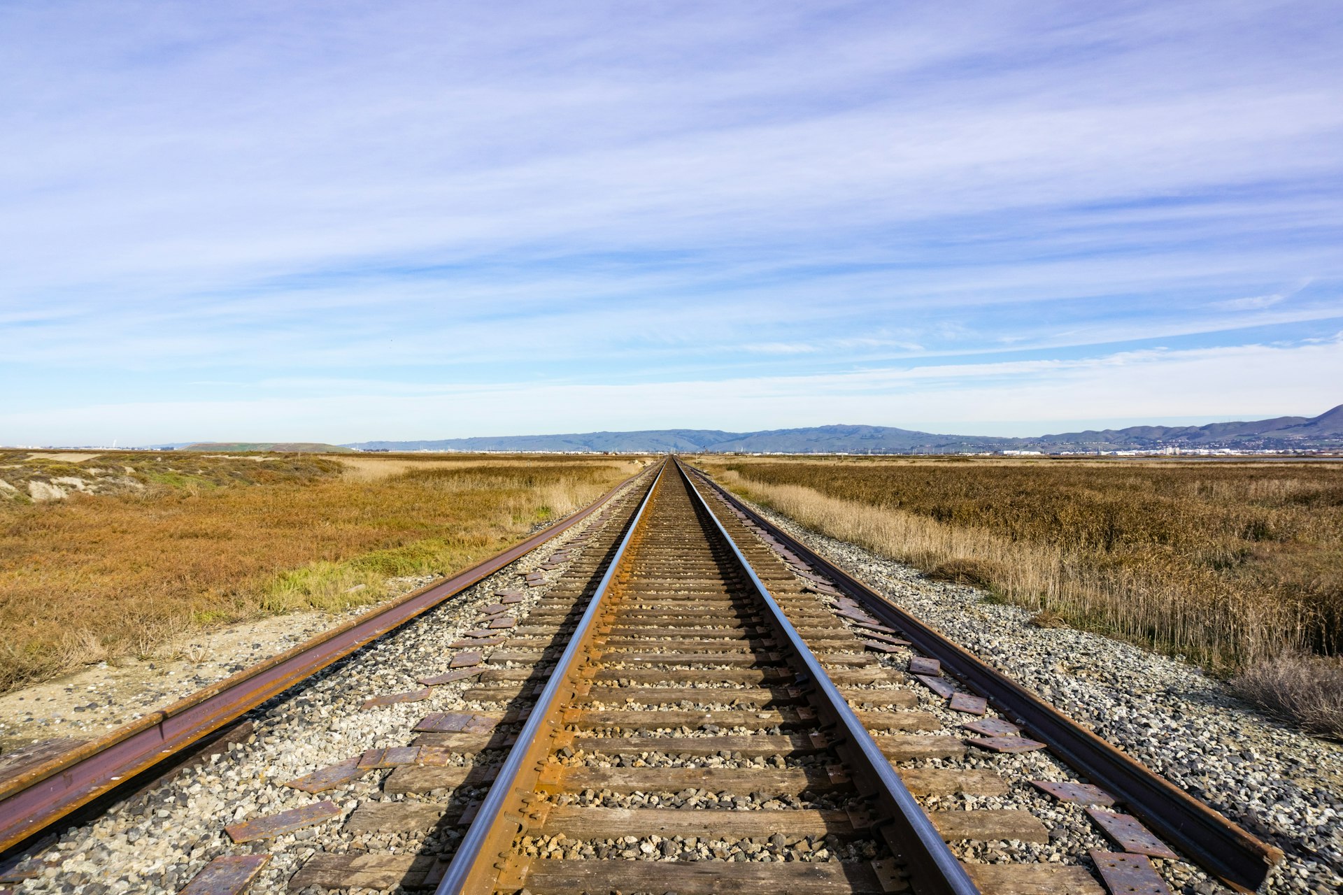 Railroad tracks across marshland, Alviso, San Jose, south San Francisco bay area, California, USA