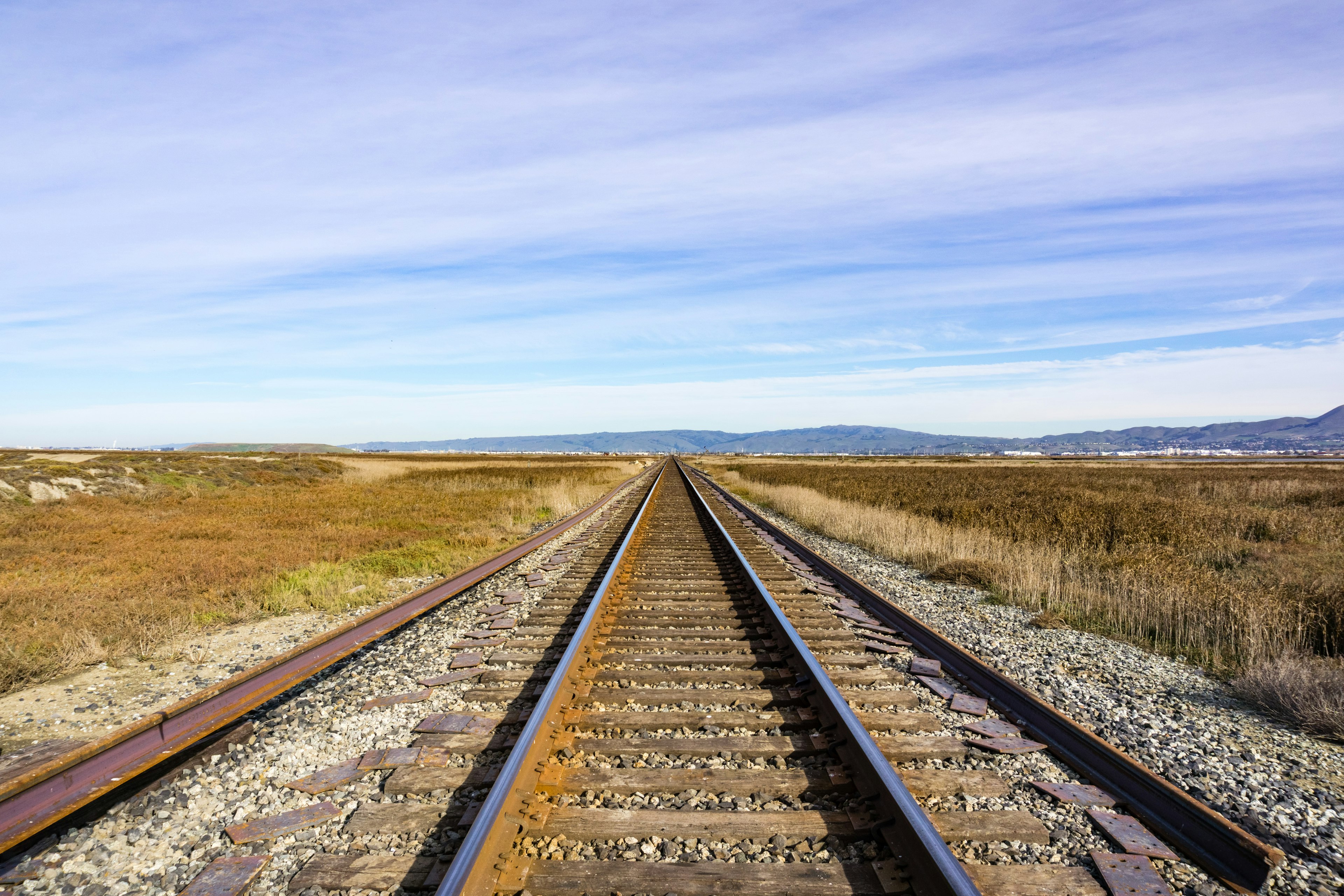 Railroad tracks across marshland, Alviso, San Jose, south San Francisco bay area, California, USA