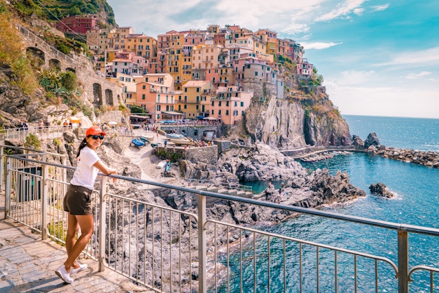 woman visit Manarola Village, Cinque Terre Coast Italy. Manarola is a beautiful small colorful town province of La Spezia, Liguria, north of Italy and one of the five Cinque terre national park Italy
1213749700