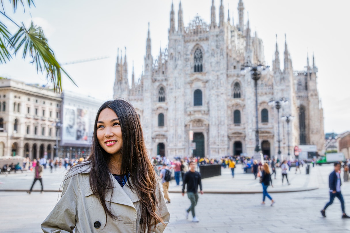 Tourist woman posing near Duomo cathedral in Milan, Italy, Europe
1225551300