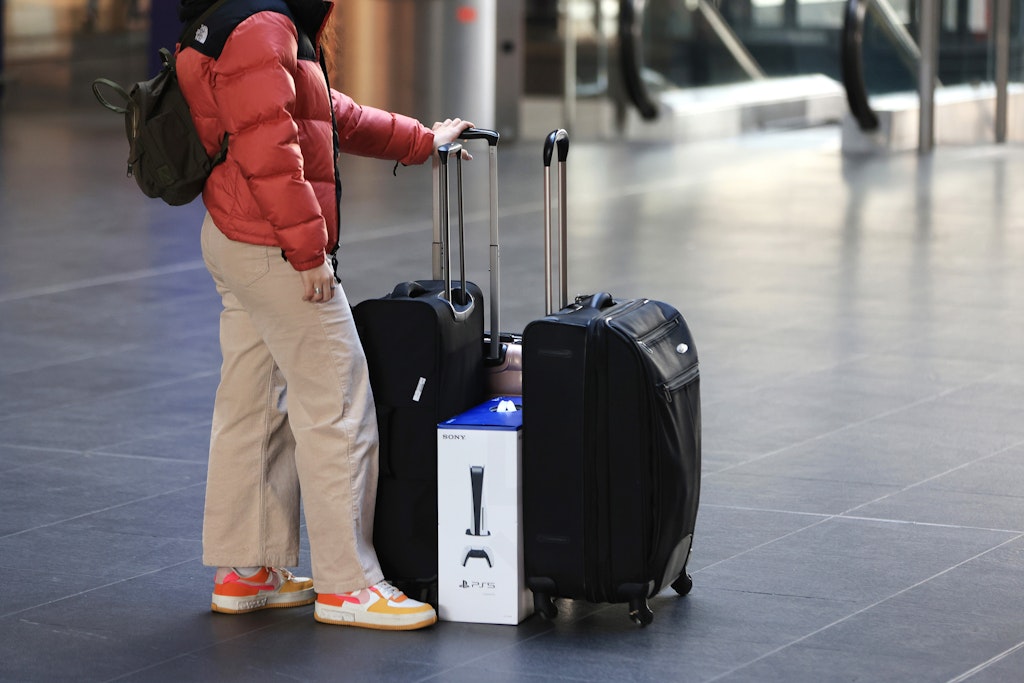 A traveler waits with luggage at Berlin central station during a strike by public workers in Berlin, Germany, on Monday, March 27, 2023. Germanys air and rail services ground to a halt Monday during a one-day strike as workers join peers in France and the UK to fight for higher pay. Photographer: Krisztian Bocsi/Bloomberg via Getty Images
1249578250
german, european, public transit, mass transit, demonstration, passenger trains, euro members, industries, trains, strikes and pay disputes, protests,  strikes, emea, transportation and logistics, e.u.,  eu, business news, unrest