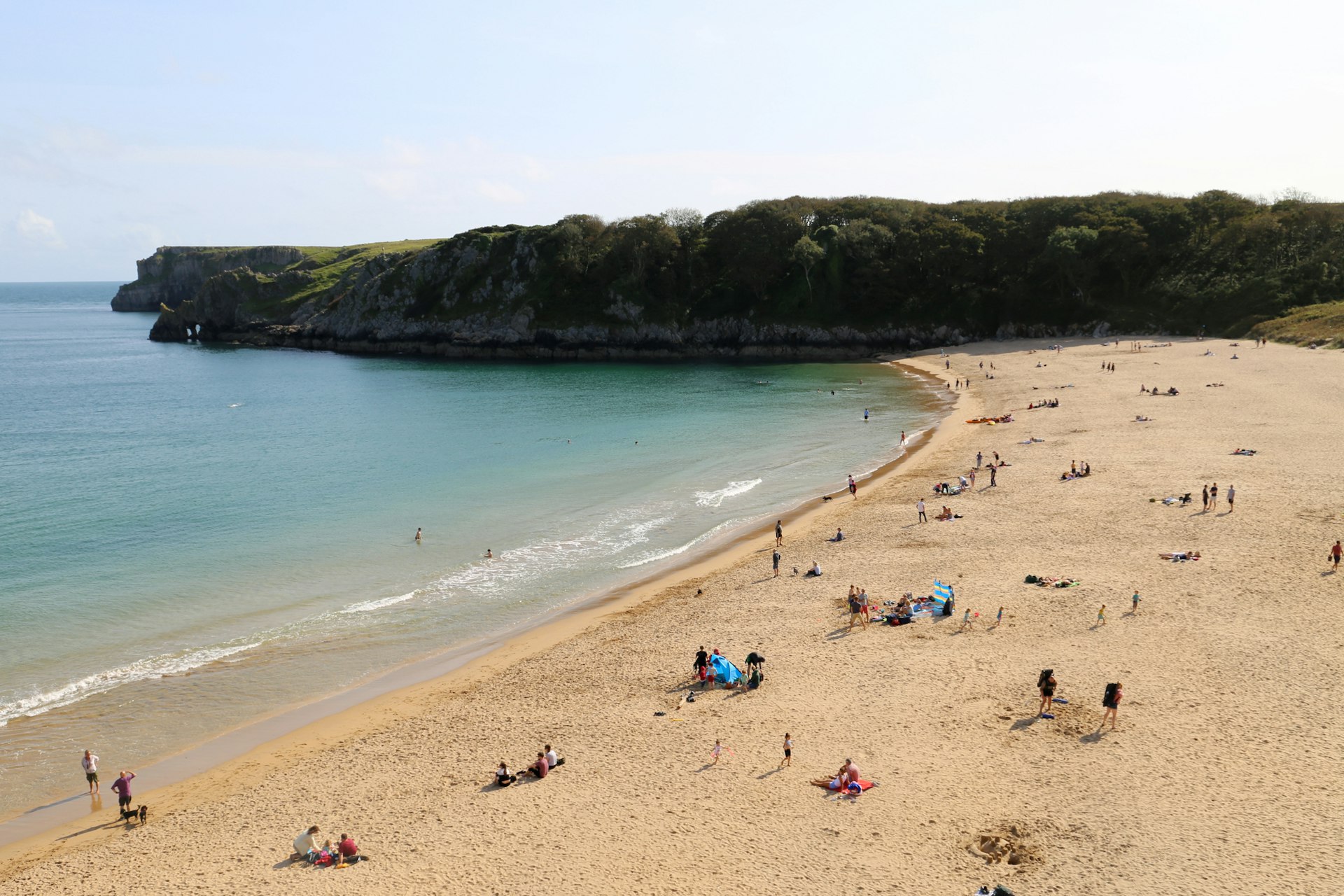 Swimmers at the beach at Barafundle Bay in Pembrokeshire in South Wales.