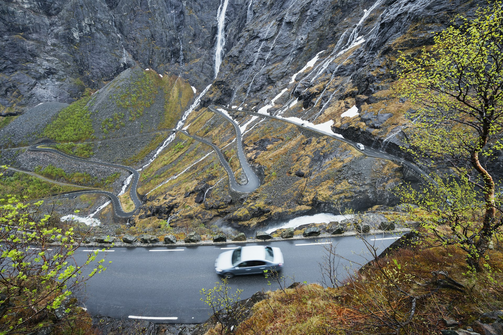 An aerial view of car ascending the Trollstigen serpentine road, Norway