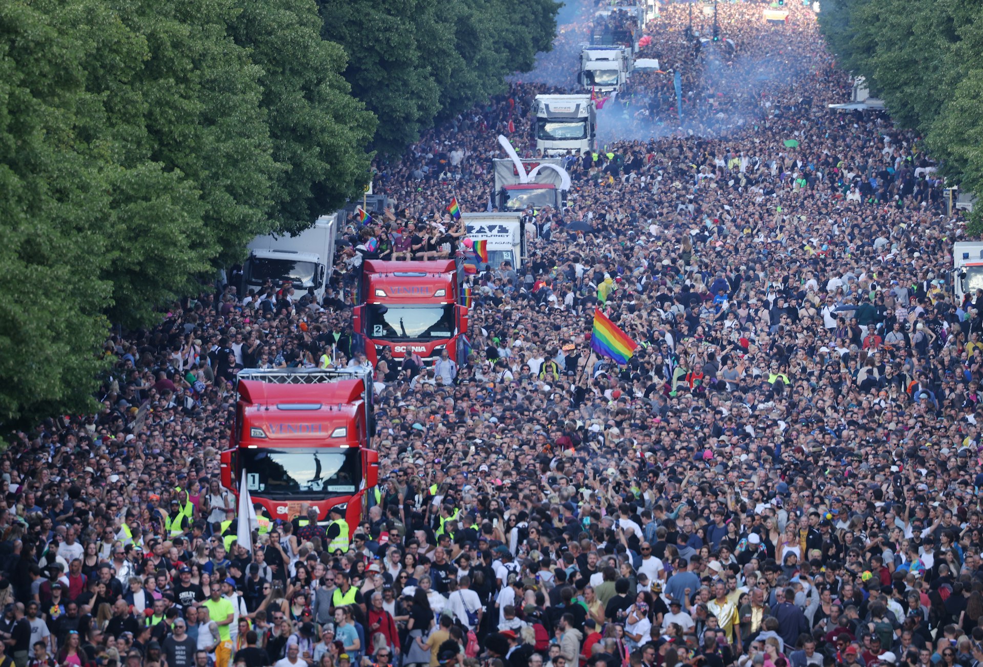 The Tiergarten is filled with trucks and participants for the Rave the Planet (Love Parade) party in 2022, Berlin, Germany