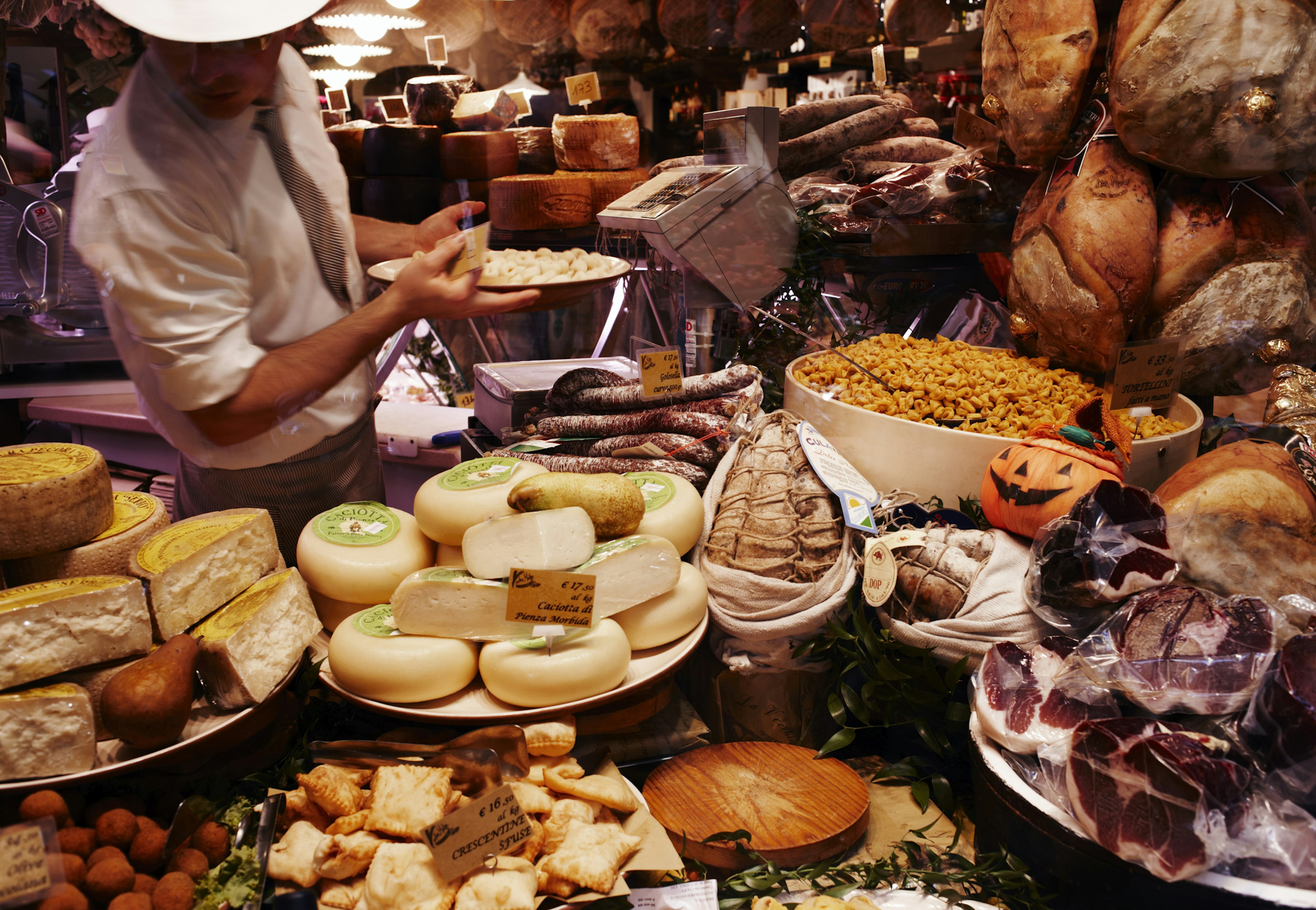 A shop window brimming with food in Bologna, Italy