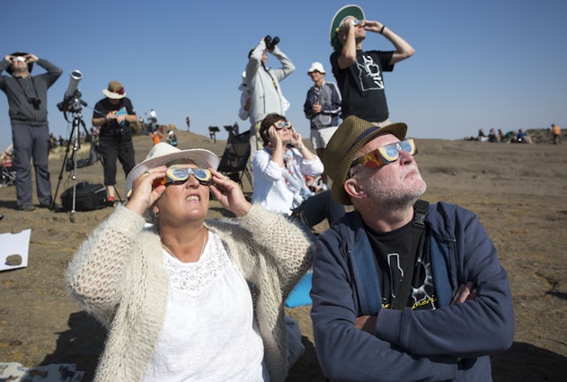 MENAN, ID - AUGUST 21: Angela and Chris Willis-Richards of London get their photo taken as they wear eclipse glasses on Menan Butte to watch the eclipse on August 21, 2017 in Menan, Idaho. Millions of people have flocked to areas of the U.S. that are in the "path of totality" in order to experience a total solar eclipse. (Photo by Natalie Behring/Getty Images)
836360358
Solar Eclipse