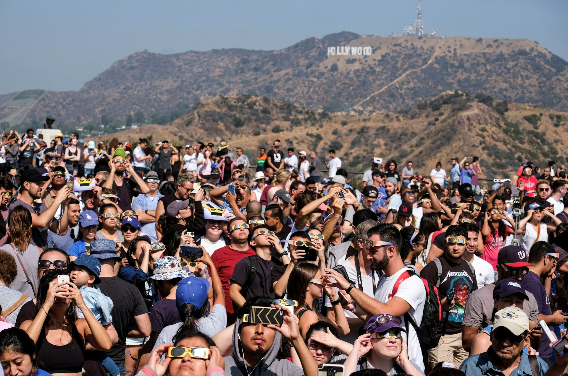 People attend a solar eclipse viewing event in 2017 at Griffith Observatory in Los Angeles, California, USA