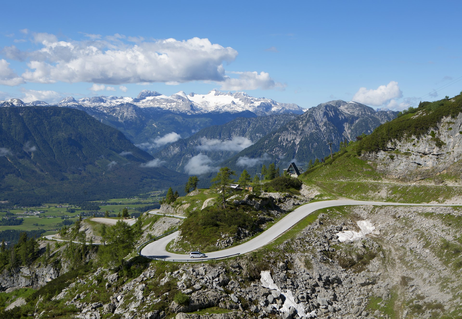 A car on a windy road in the Salzkammergut, Alps, Austria, Europe
