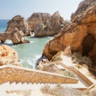 Rocky cliff seascape with steps to beach in Lagos, Algarve, Portugal. Ponta Da Piedade Beach in Lagos.
467367415
Algarve; Beach; Beige; Lagos; Lagos - Portugal; Steps; Nature; Tranquil Scene; Travel Destinations; Cliff; Color Image; No People; Outdoors; Portugal; Rock - Object; Rock Formation; Day; Eroded; Horizontal; Photography; Scenics; Sea; Seascape;