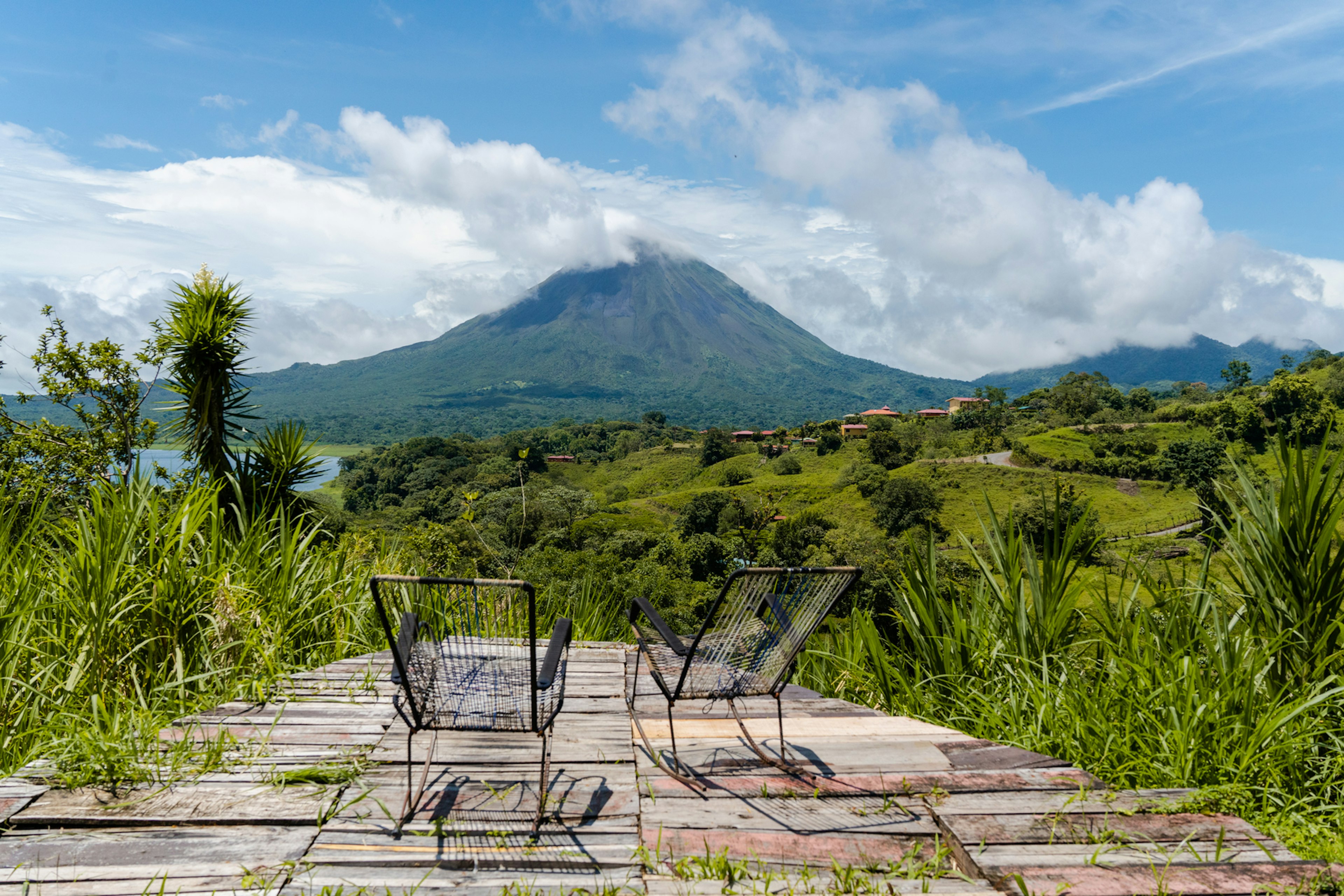 Two chairs on a deck overlooking Volcán Arenal, La Fortuna, Costa Rica