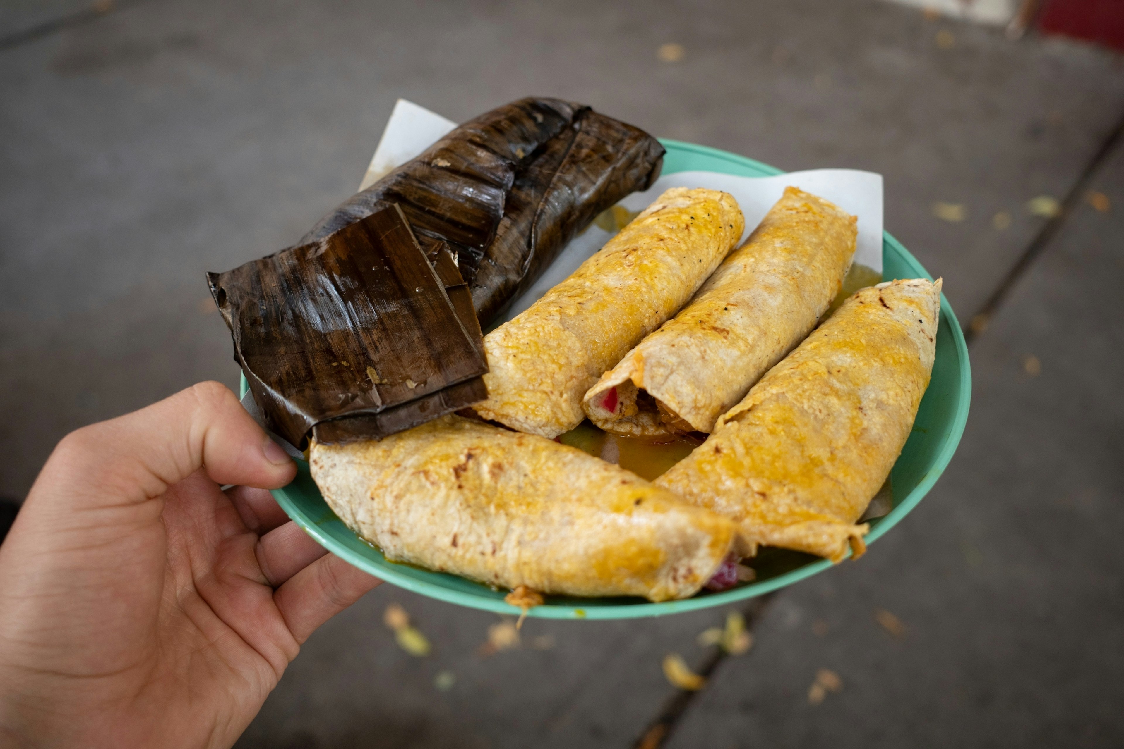 A plate of tacos and tamales in Mexico City.