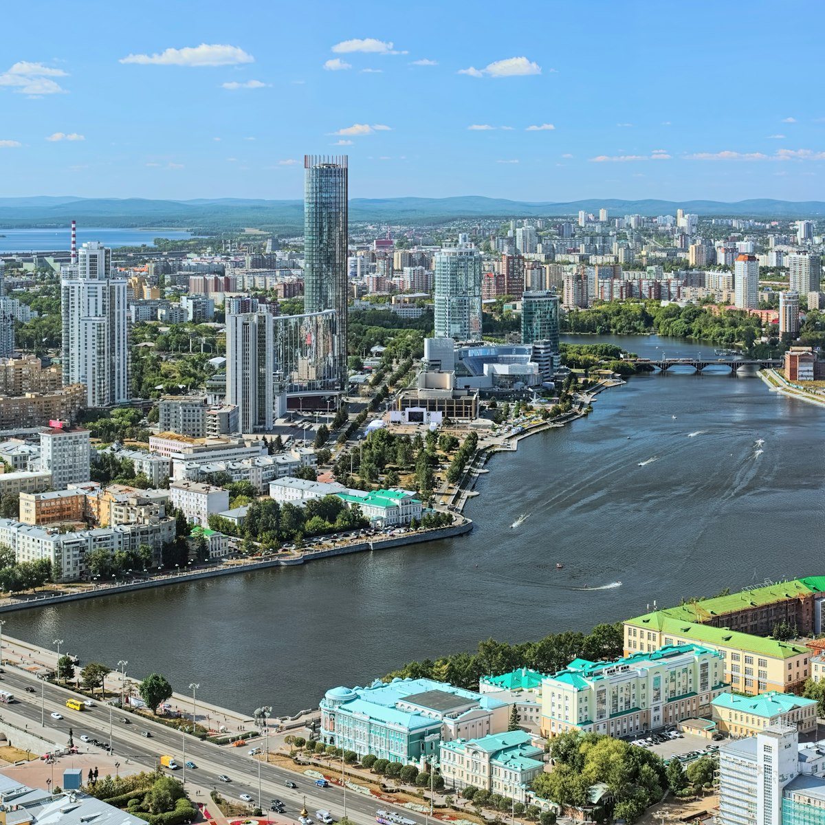 View of the historical center, city pond with dam, Yekaterinburg-City neighborhood and north-western side of the city from the observation deck on the 52nd floor of the Vysotsky skyscraper at 186 meters above the ground in Yekaterinburg.