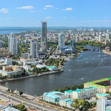 View of the historical center, city pond with dam, Yekaterinburg-City neighborhood and north-western side of the city from the observation deck on the 52nd floor of the Vysotsky skyscraper at 186 meters above the ground in Yekaterinburg.