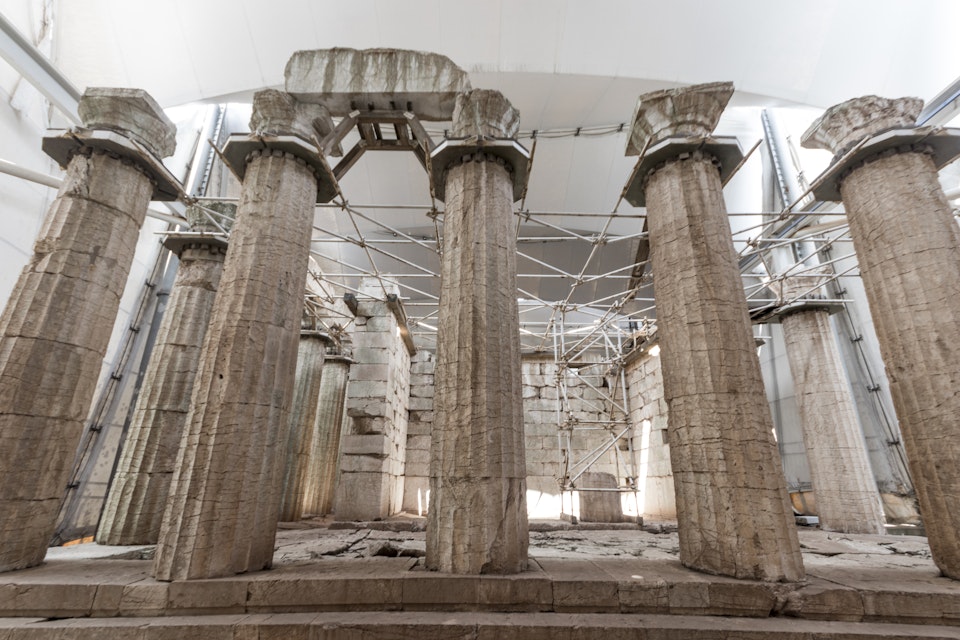 Ruined columns of the Temple of Apollo Epicurius inside a tent, Bassae, Greece.