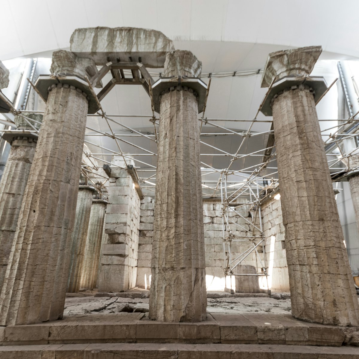 Ruined columns of the Temple of Apollo Epicurius inside a tent, Bassae, Greece.