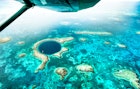 Aerial panoramic view of The Great Blue Hole - Detail of Belize coral reef from airplane excursion - Wanderlust and travel concept with nature wonders on azure vivid filter
1460271564
great