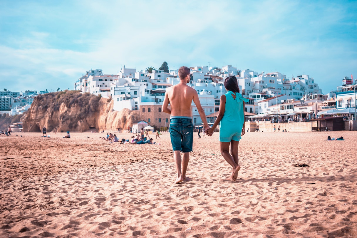 happy Young couple walking at the beach of Albufeira Algarve Portugal; Shutterstock ID 1025917321; your: Claire Naylor; gl: 65050; netsuite: Online ed; full: Portugal beaches
1025917321