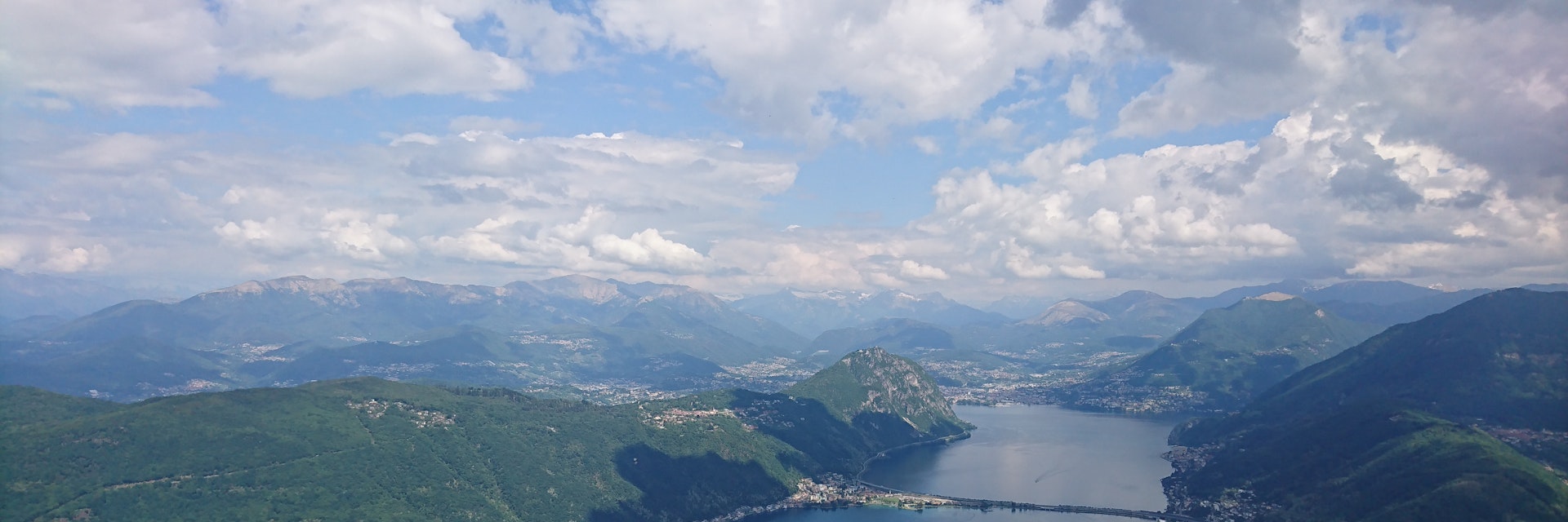 View of Lago di Lugano and the city of Lugano from Monte San Giorgio summit.