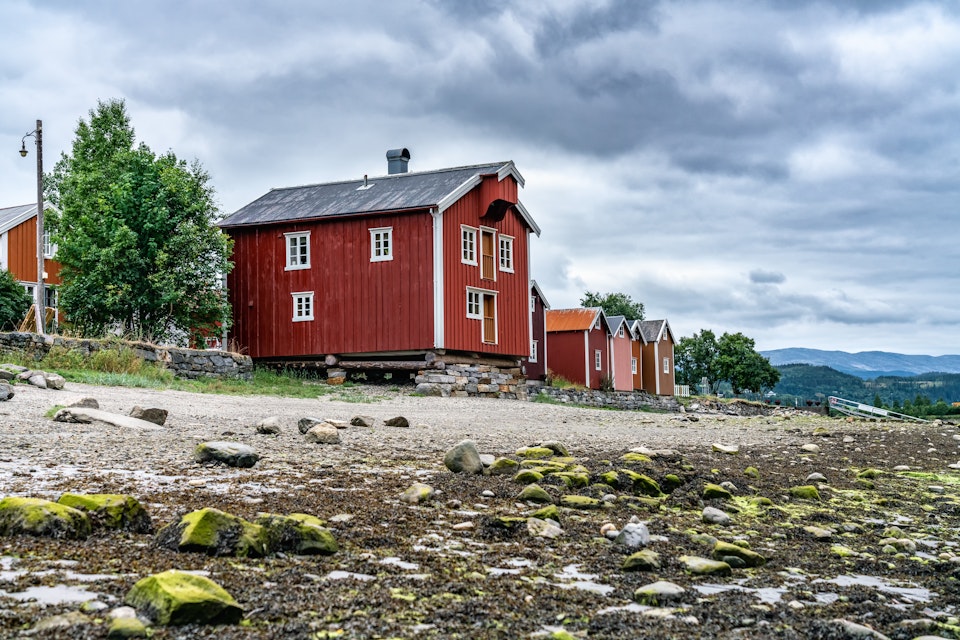The fishermen's houses close to river Vefsna, in Sjogata, Mosjoen, Norway. 