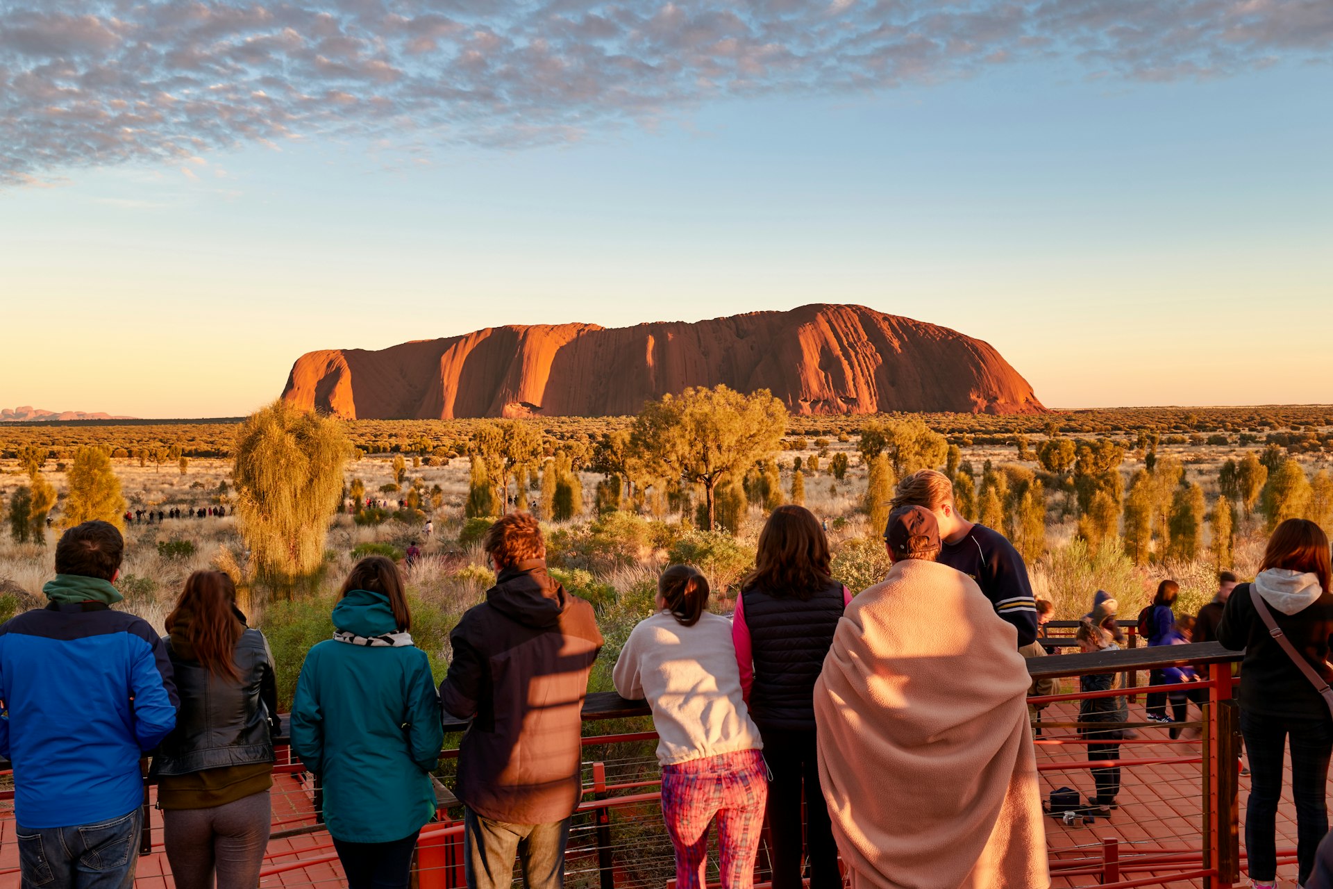 Crowds look at Uluru at dusk, Red Centre, Northern Territory, Australia