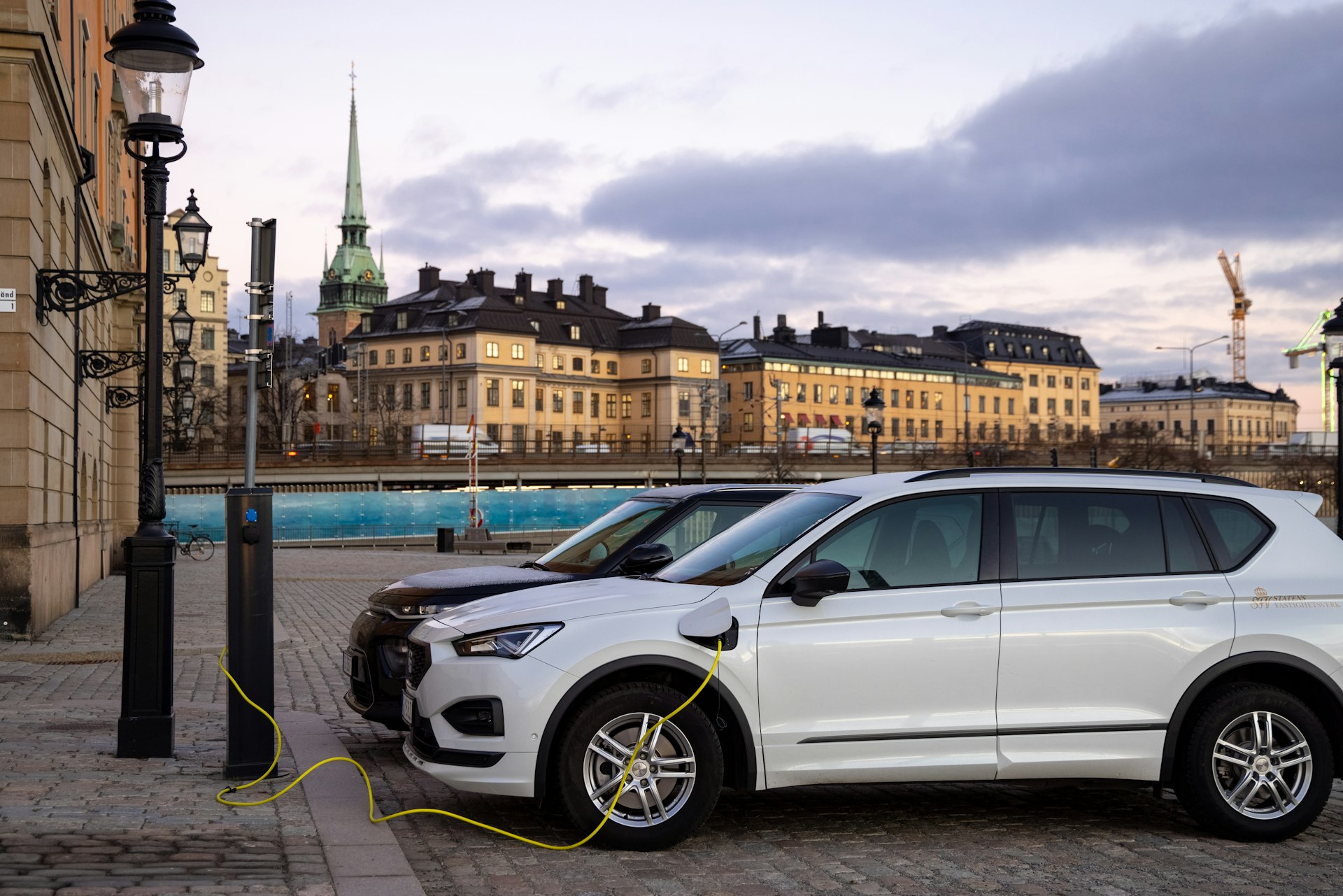 Electric cars charging in the historic center of Stockholm, Sweden