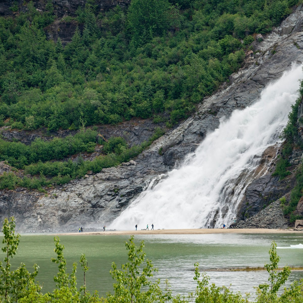 Nugget Creek falls cascade into Mendenhall Lake, close to Juneau, Alaska.