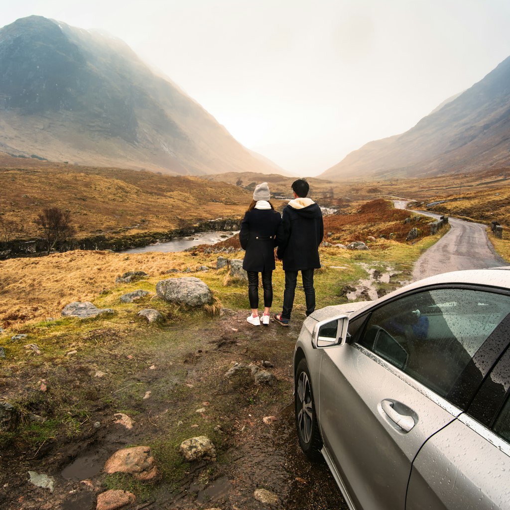 Young couple is relaxing and enjoying the view of mountain filming location of Skyfall Movies After The Rain, Glencoe valley, Scotland.; Shutterstock ID 495640633; your: Claire Naylor; gl: 65050; netsuite: Online ed; full: Scotland road trips
495640633