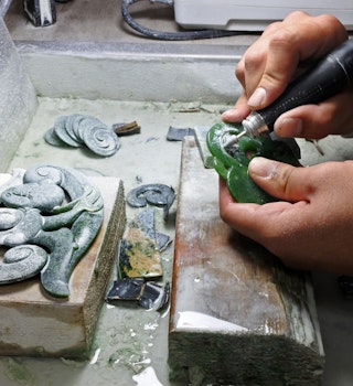 ROTORUA, NZL - APR 24 2017:Hands of a Jade ornamental green rock carver at work. New Zealand Jade protected under the Treaty of Waitangi, and the exploitation of it is restricted and closely monitored; Shutterstock ID 633183242; your: Claire Naylor; gl: 65050; netsuite: Online ed; full: Greenstone pendants in New Zealand
633183242