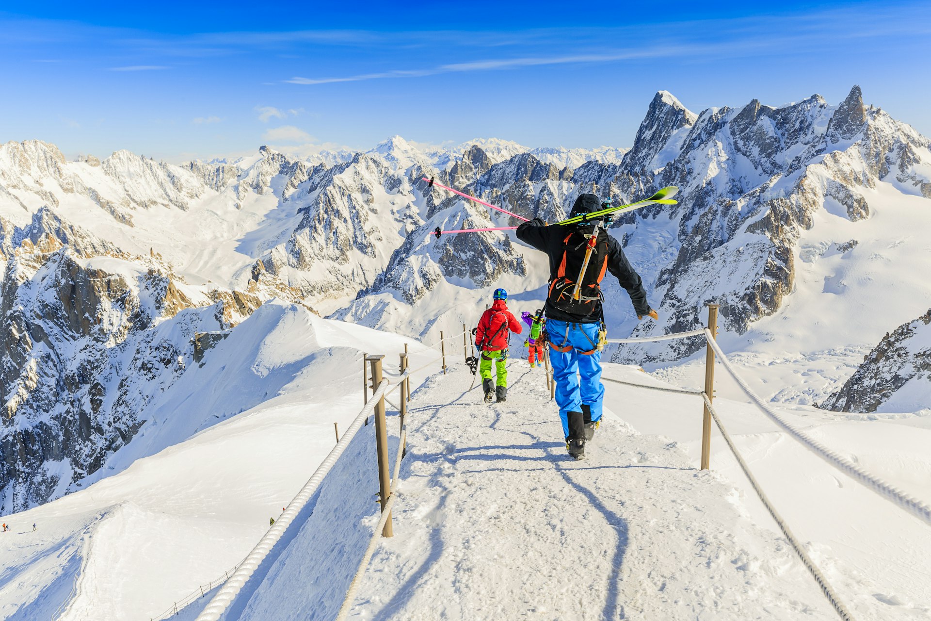 Freeriders carrying their extreme ski equipment in Aiguille du Midi, French Alps