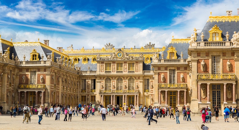 A crowd outside the Palace of Versailles on a summer day.
369300248
historical, france, versailles, cloud, travel, view, day, european, urban, landmark, sites, symbol, castle, history, touristic, palace, chateau, summer, outside, old, people, de, building, tourist, historic, front, traveler, world, place, decorative, unesco, famous, heritage, cloudy, garden, architecture, french, king, sky, tourism, art, ancient, royal, residence, nature, europe, facade