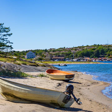 Two boats lie ashore on the North shore of South Koster Island (Sydkoster) with a view of the North Koster Island (Nordkoster) in Sweden.