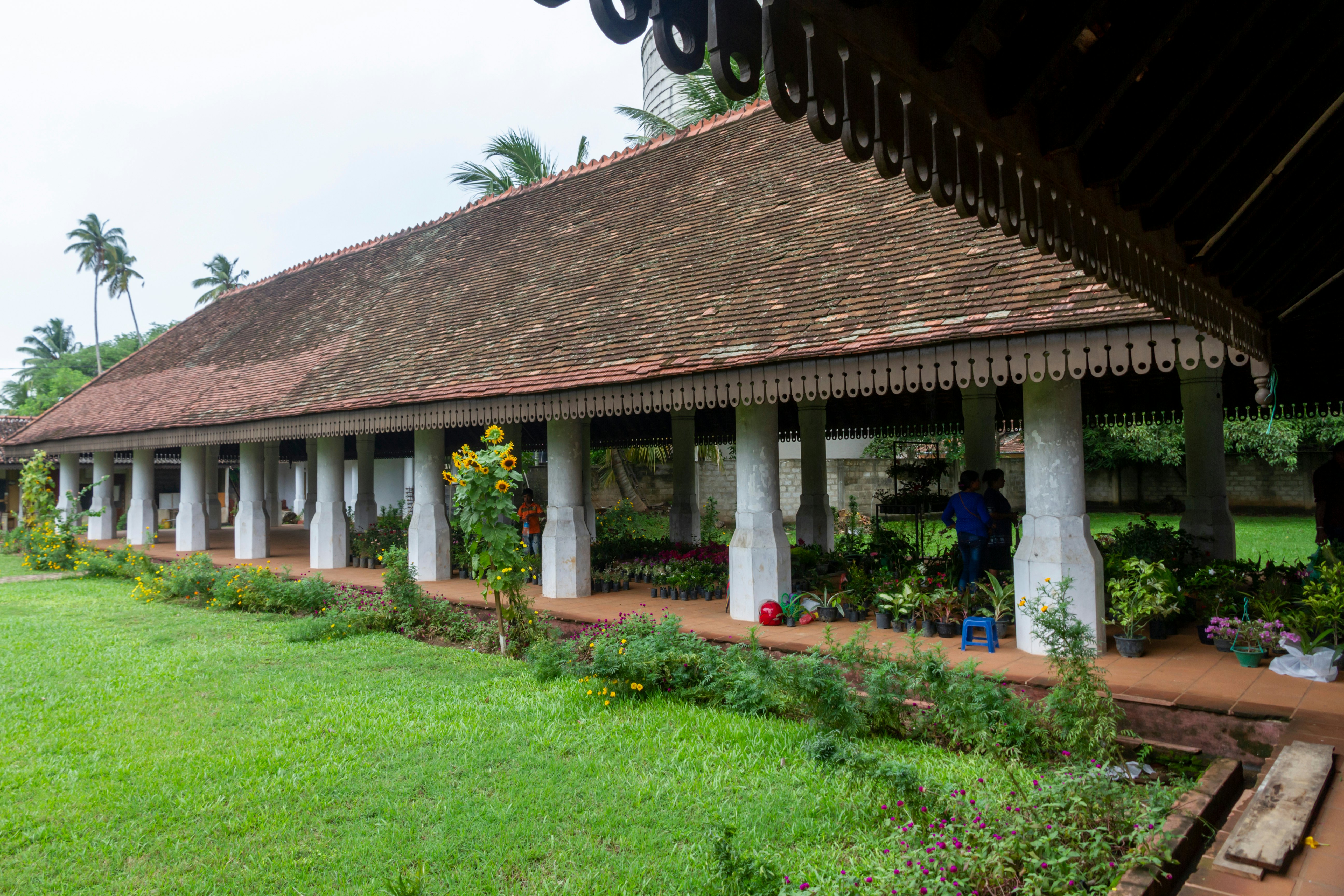 The gardens, lawn and pillars of the local popular Nupe Market, a grand old historical Dutch colonial building and center of trade for centuries.