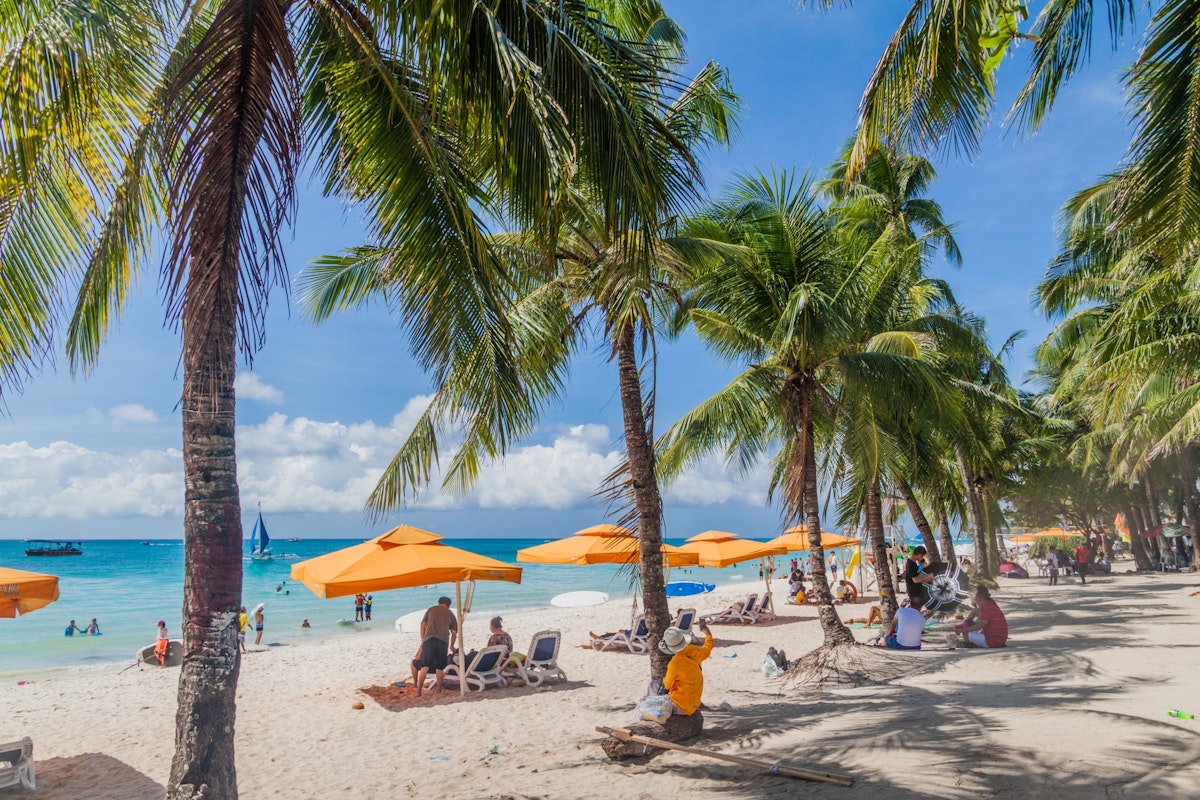 People enjoy White Beach at Boracay island, Philippines.