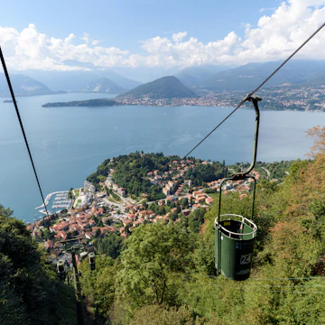 Two-seat cable cars take you gently up almost to the summit of Sasso del Ferro mountain, from where you can admire a magnificent view over Lake Maggiore.