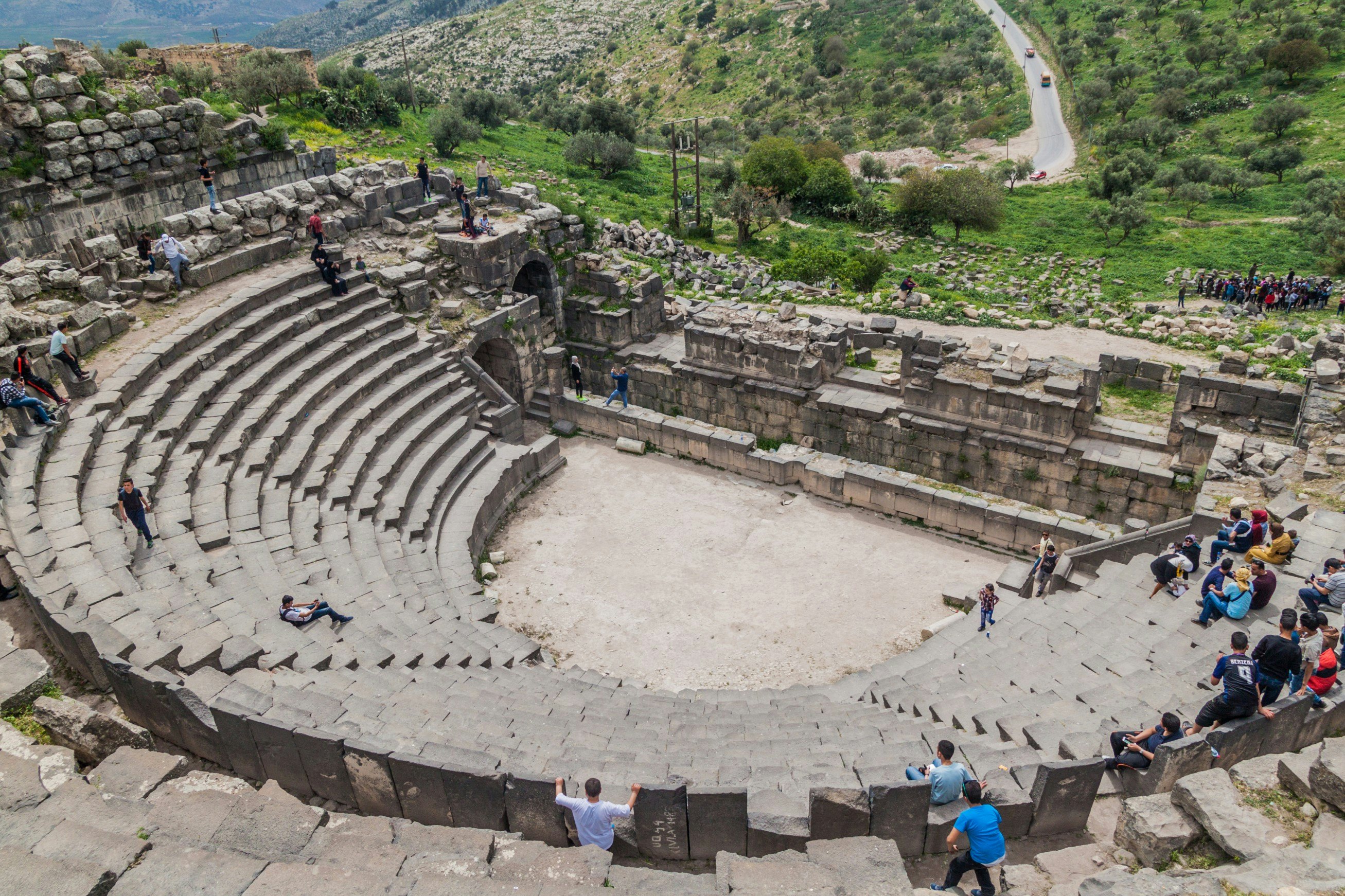 Tourists visit the West Theatre ruins in Umm Qais.